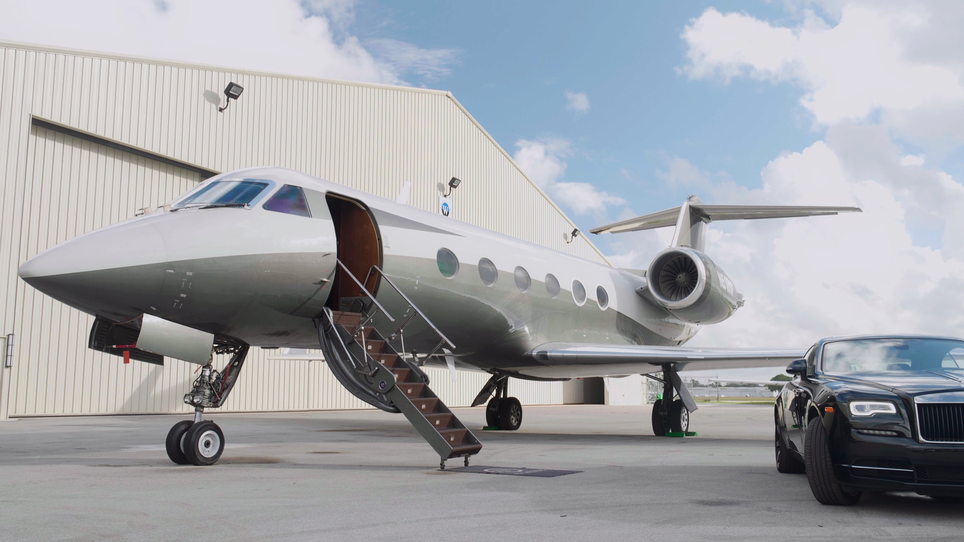 A private aircraft and car pictured in a supplied Creative Core Marketing Agency production image.